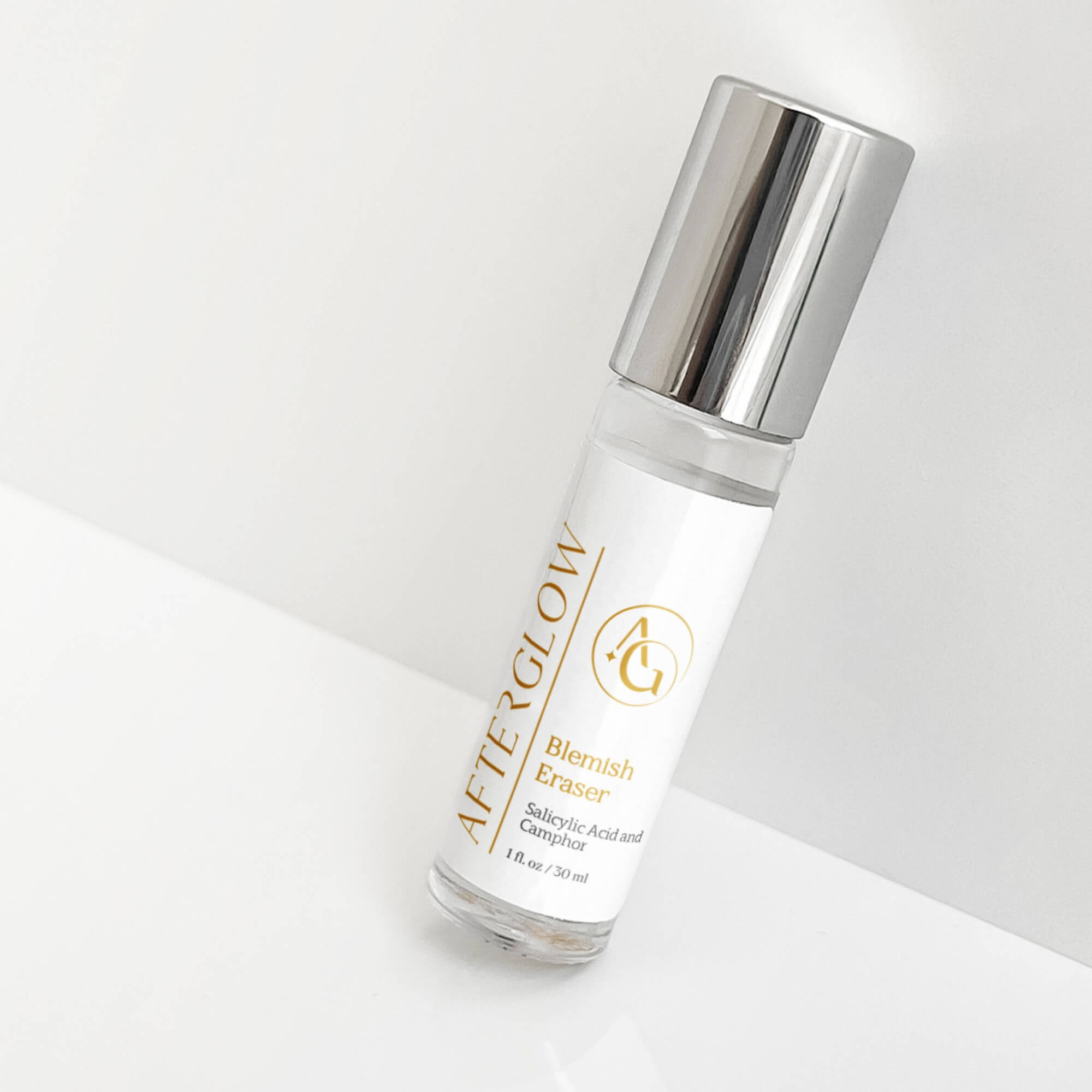 Afterglow Skin Co. blemish eraser serum bottle on a light background