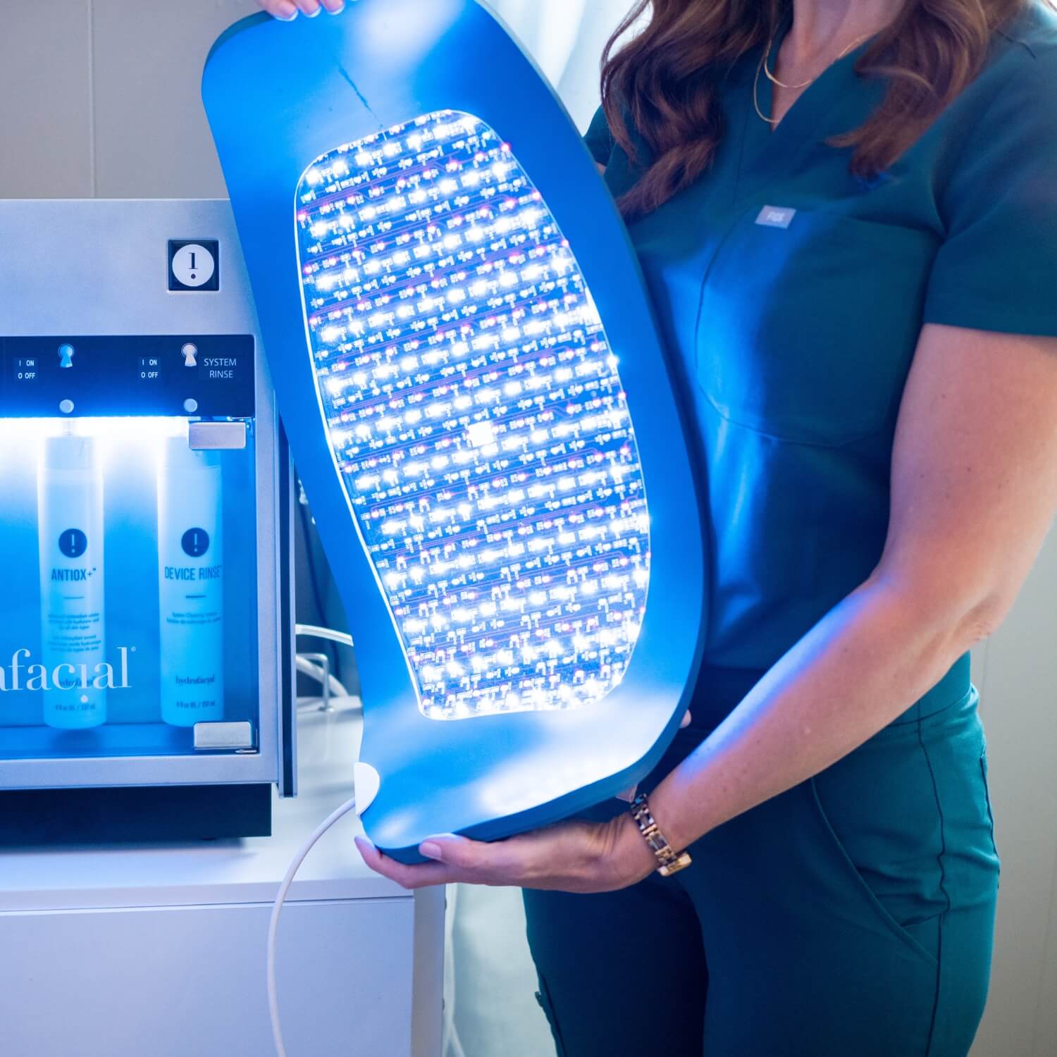 Woman holding a light machine