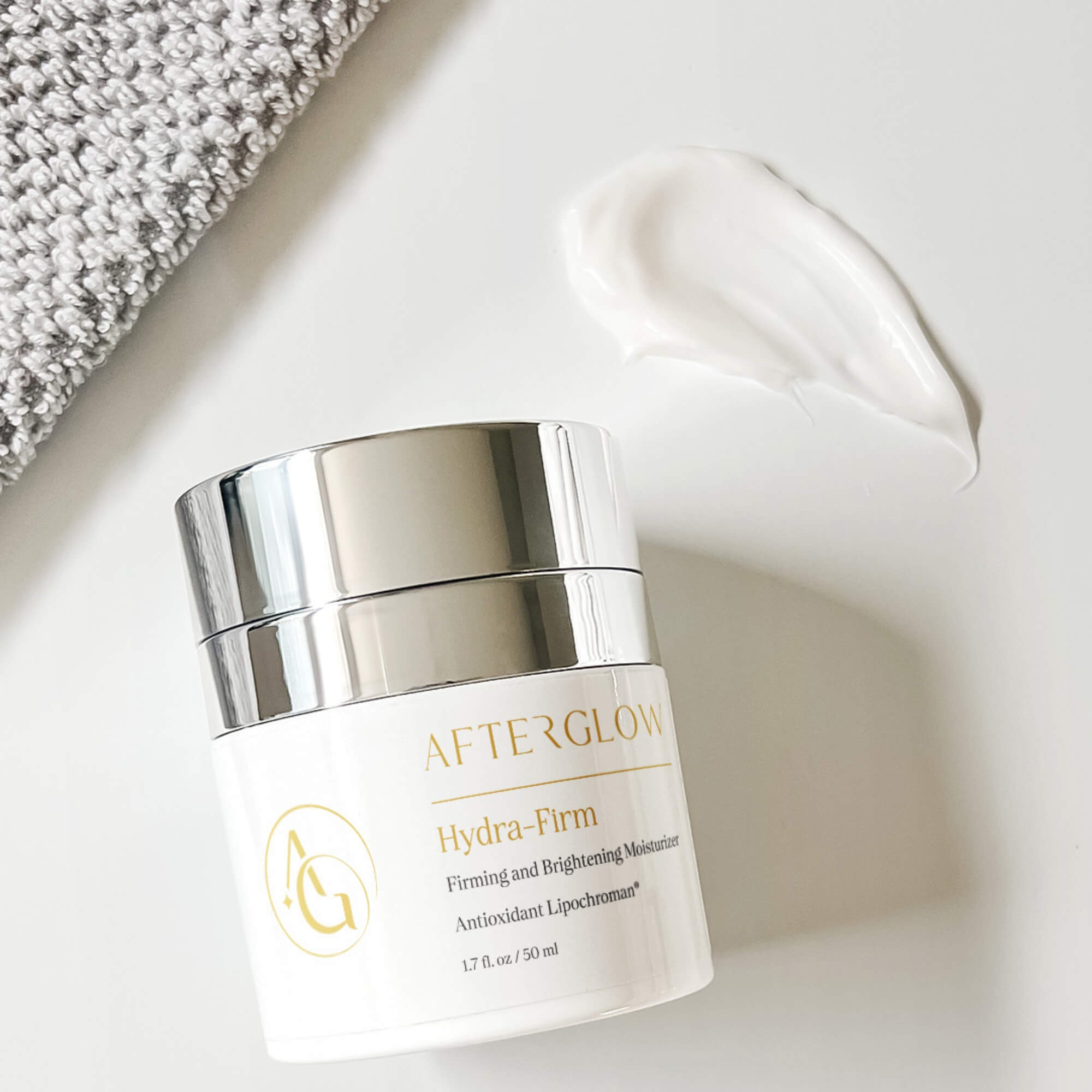Afterglow Skin Co Hydra-Firm moisturizer on a light background