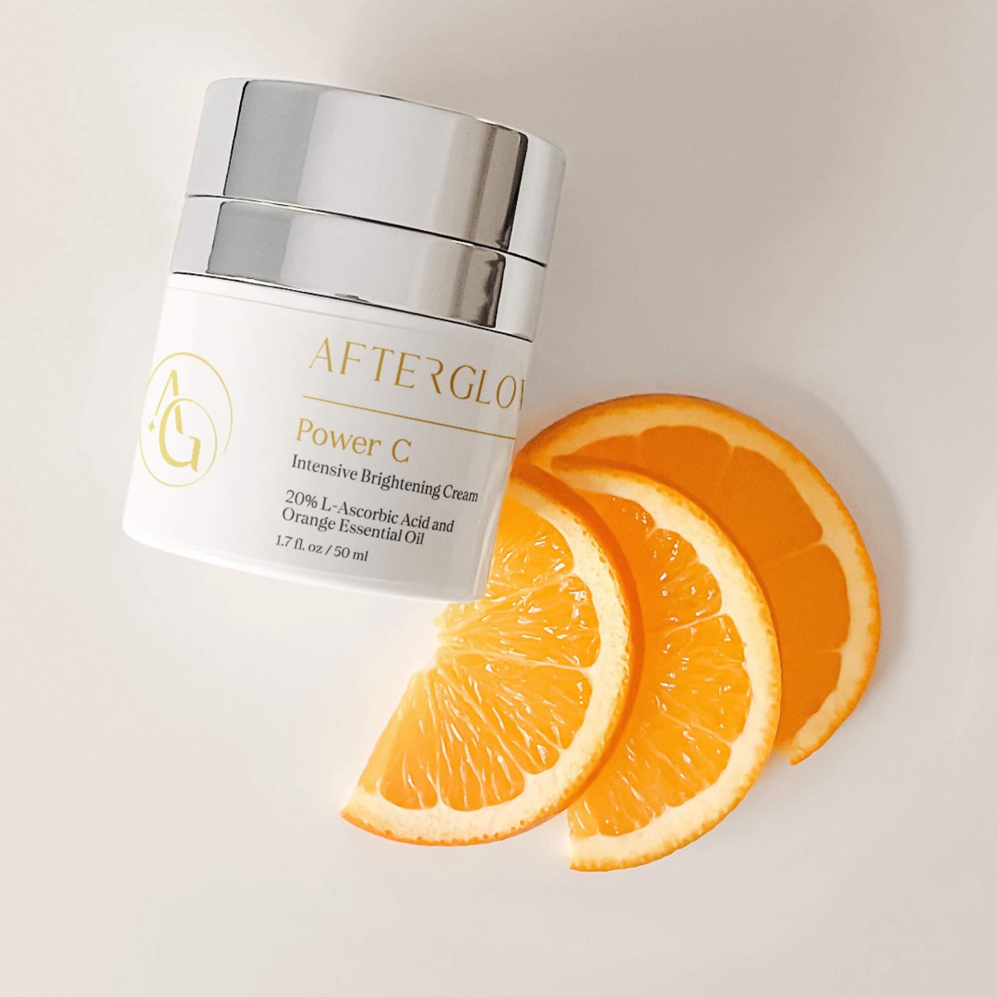 Afterglow Skin Co. with orange slices on a light background