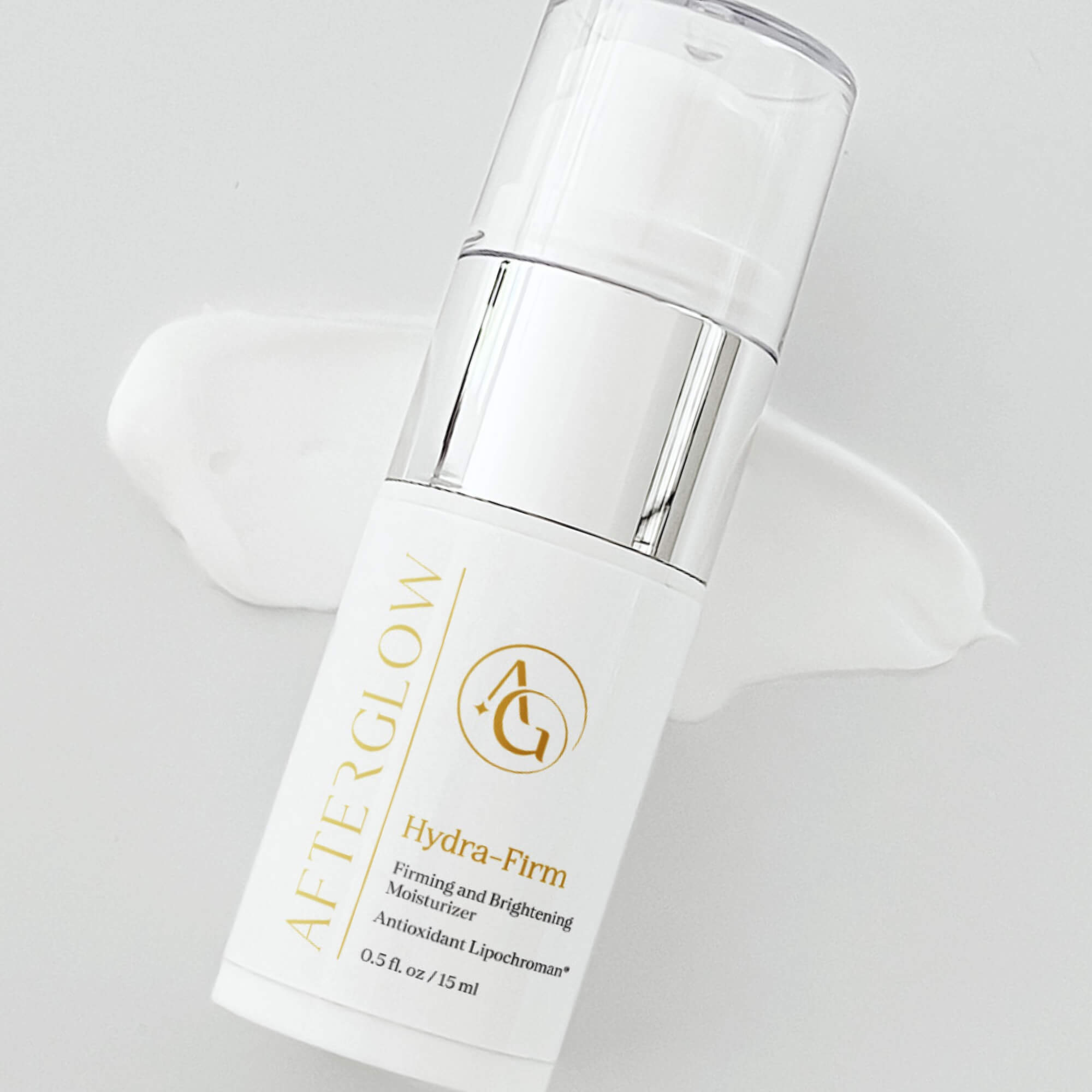 Afterglow Skin Co. Hyrda-firm travel size moisturizer on a light gray background